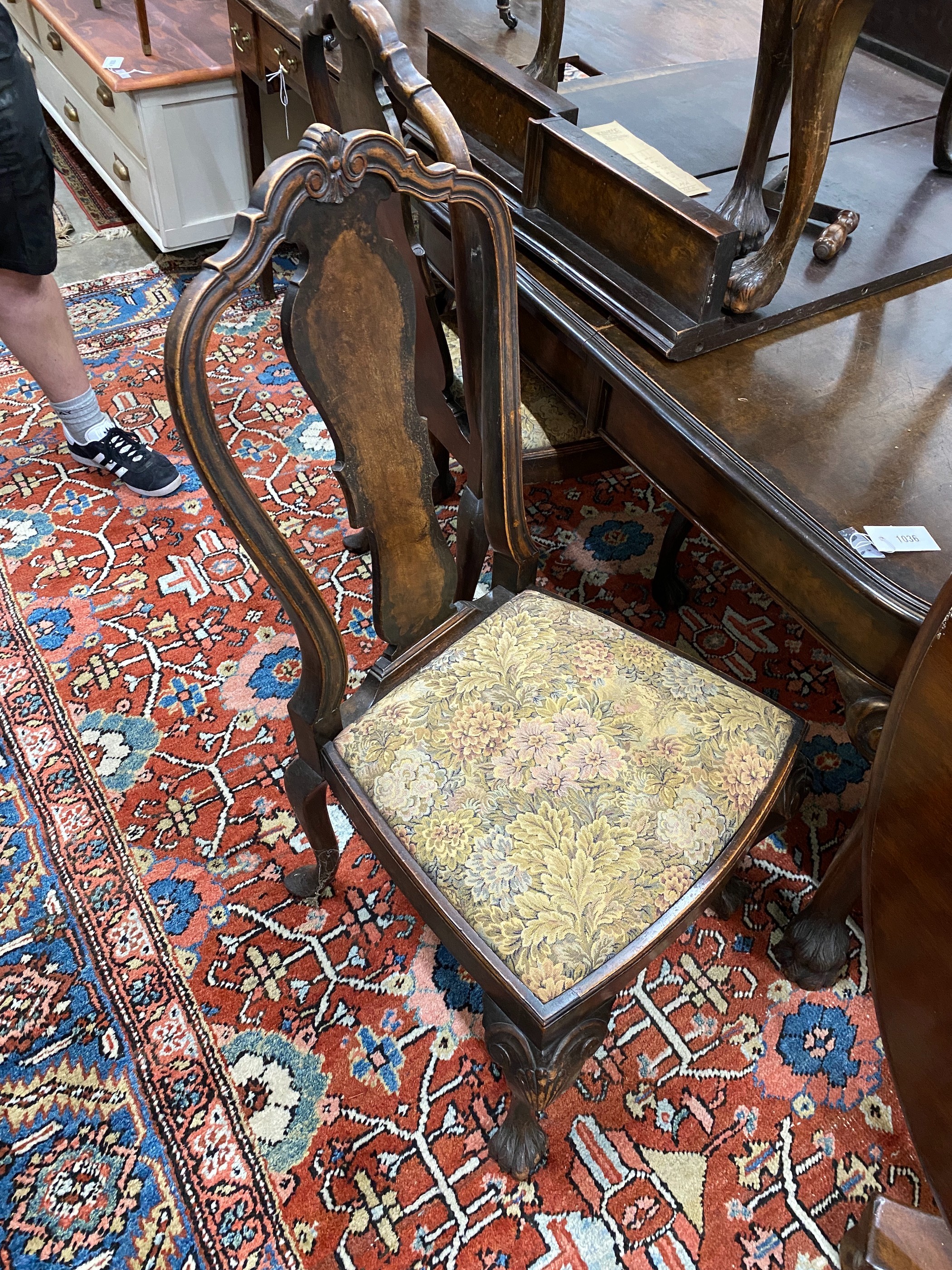 A Queen Anne revival burr walnut dining room suite, comprising extending dining table 208cm extended, two spare leaves, width 106cm, height 74cm and six dining chairs, two with arms